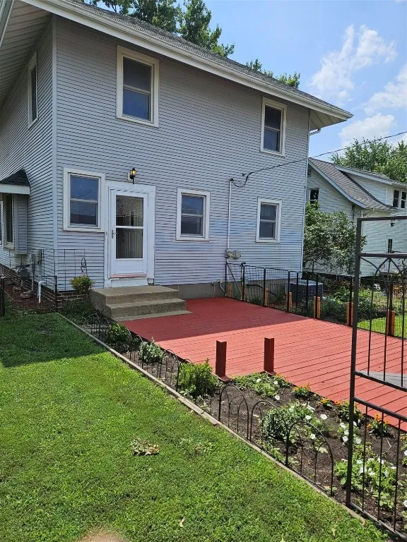 Back of house view with stained walkway