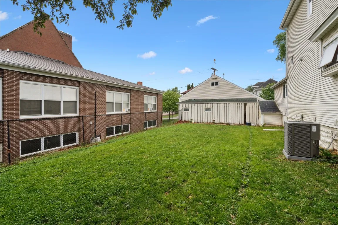 fully fenced yard includes a bonus enclosed area