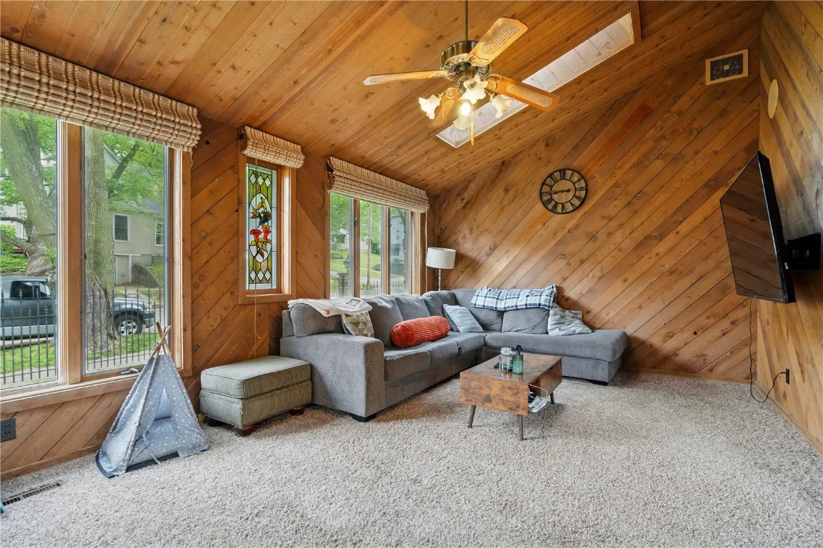 The Den features skylights, warm wood finishes, and access to the Patio