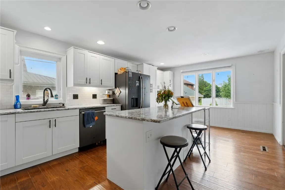 A spacious kitchen with great natural light ready for great meals and many conversations