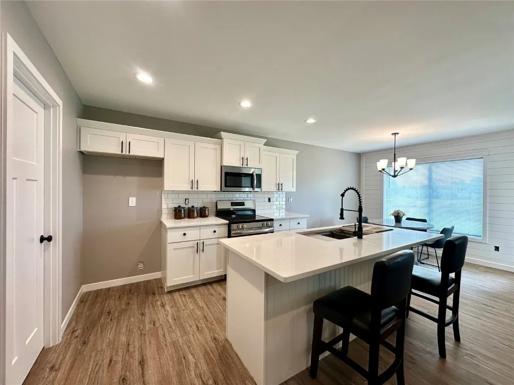 Kitchen Includes Separate Pantry and Main Floor Laundry. Coat Closet in Laundry Room. - Left Side of Picture.