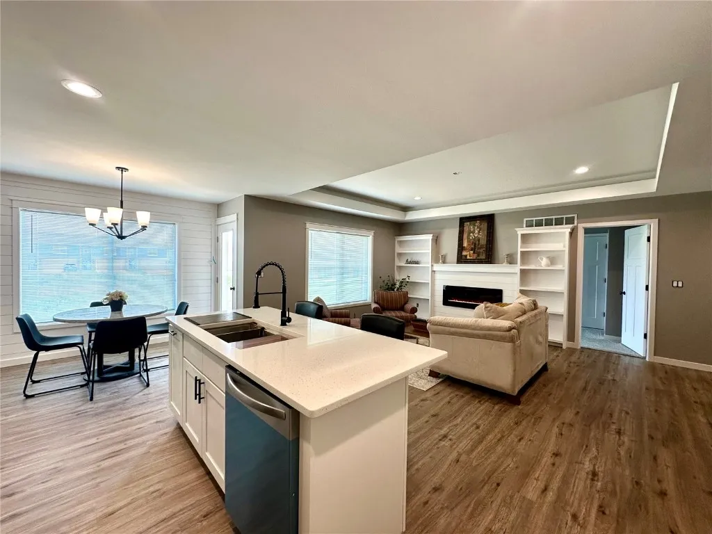 Main Level - Open Floor Plan - Quartz Countertops, Electric Fireplace. Door in the picture provides access to a 10' X 13' Deck.