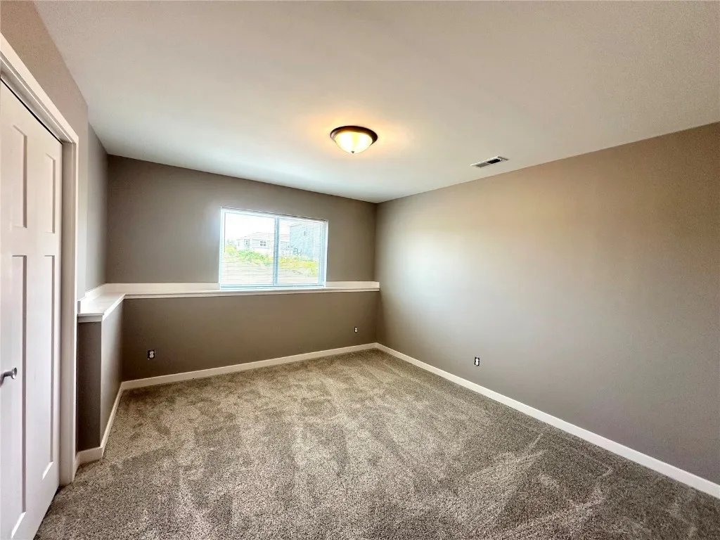 Lower Level 3rd Bedroom with Electric Fireplace. If a buyer wants to have the lower level finished by the builder - Cost $31,000. Currently Unfinished.