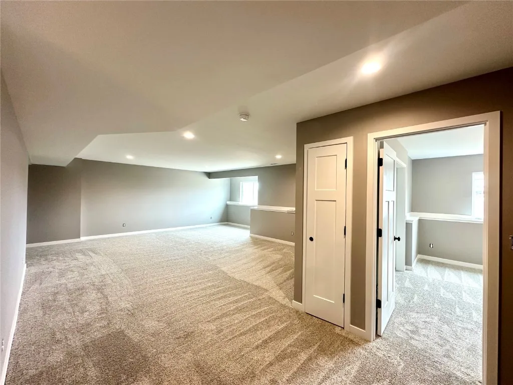 Lower Level Rec Room with Electric Fireplace. If a buyer wants to have the lower level finished by the builder - Cost $31,000. Currently Unfinished.