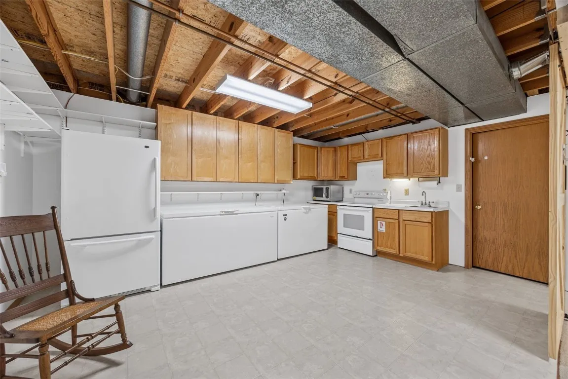 Lower Level Kitchen. (the smaller freezer is not staying).