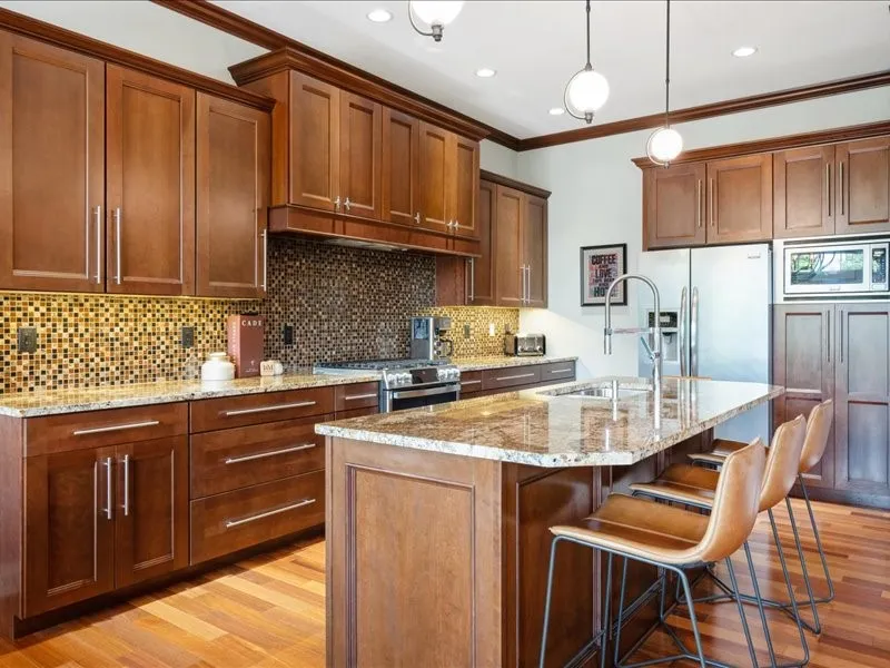 kitchen - cherry cabinets, island with seating