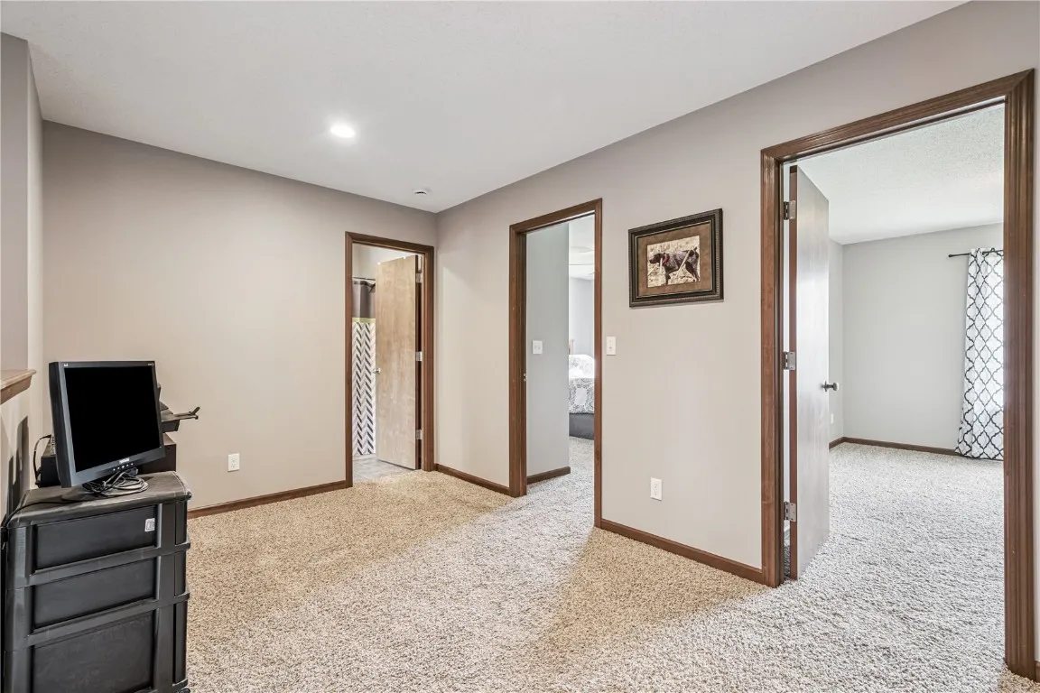 This shows a sitting are at the top of the steps with doorways to the bedrooms.