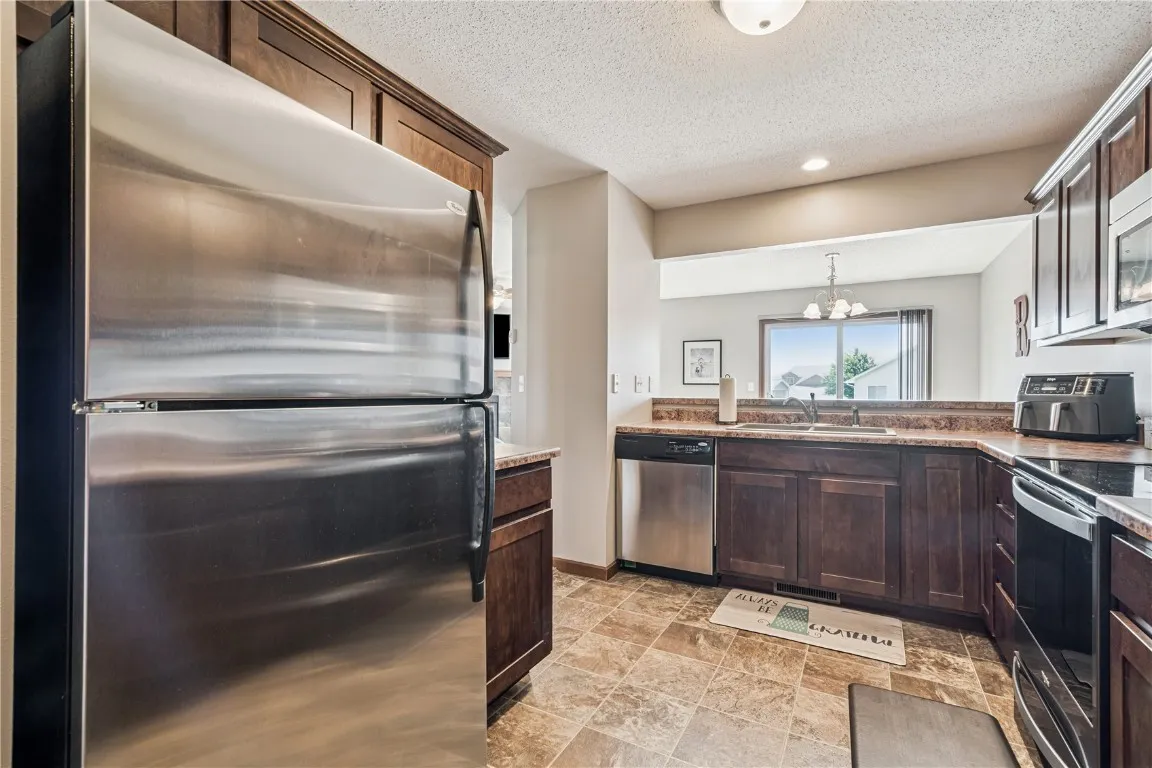 Kitchen showing doorway to living room and dining room.