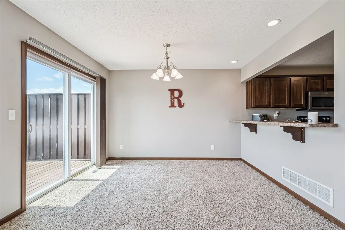 The dining room can accommodate a large table and chairs.  Slider goes to the deck.