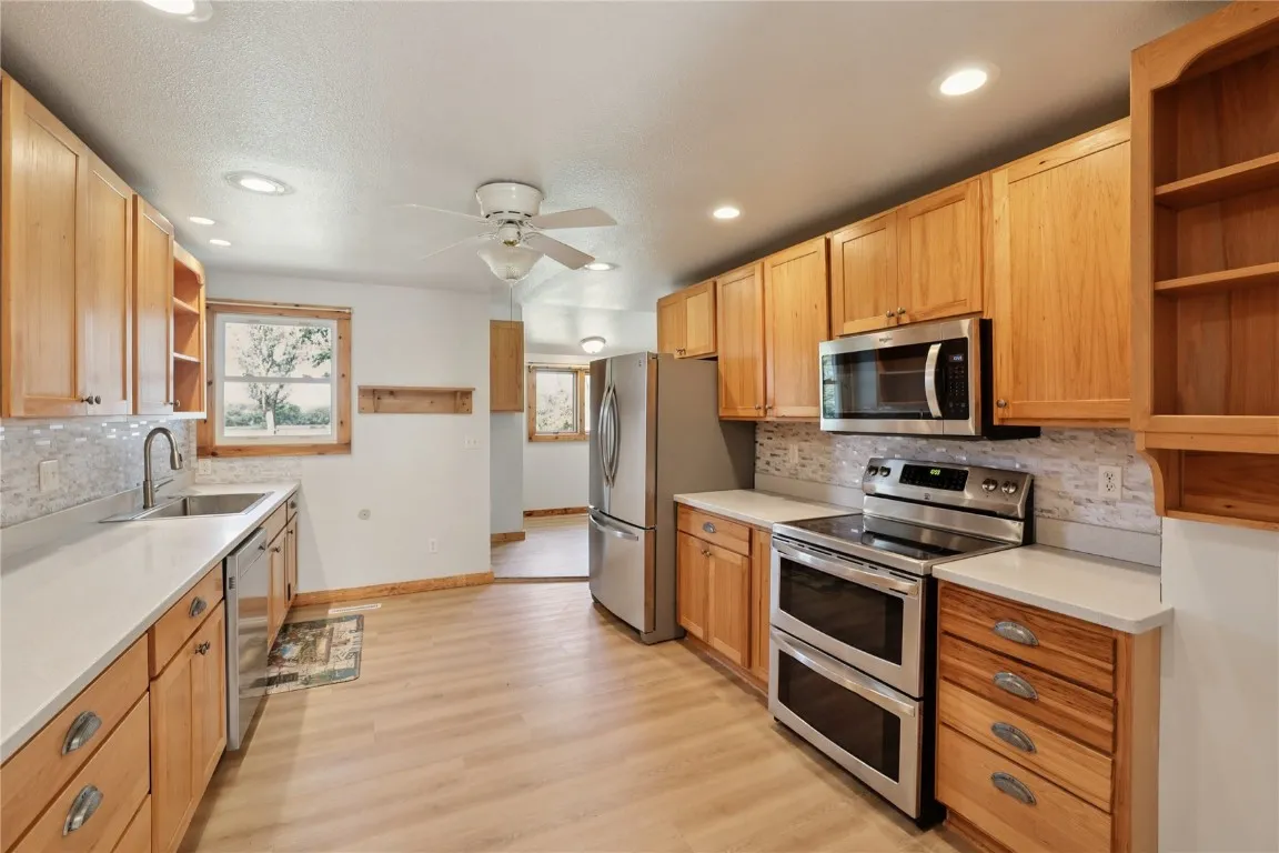 Spacious kitchen with cabinets galore.
