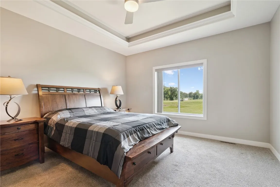 Primary bedroom with trey ceiling