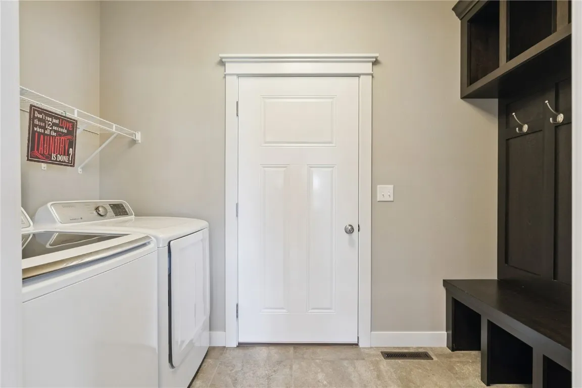 Laundry area w/washer & dryer as well as drop zone