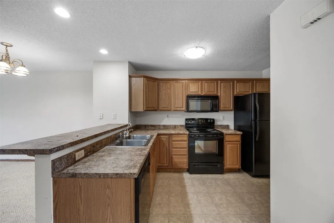 L-shaped kitchen. All applicances included.