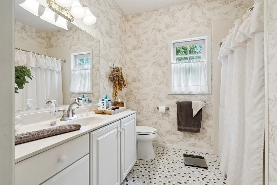 1st floor full bath off largest bedroom