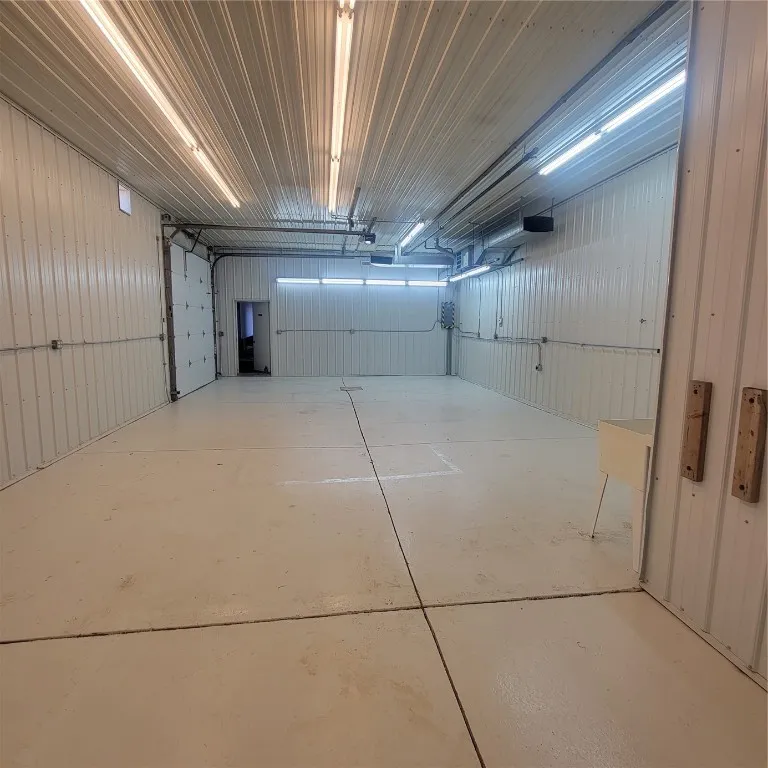 Interior of Space looking toward overhead door parking