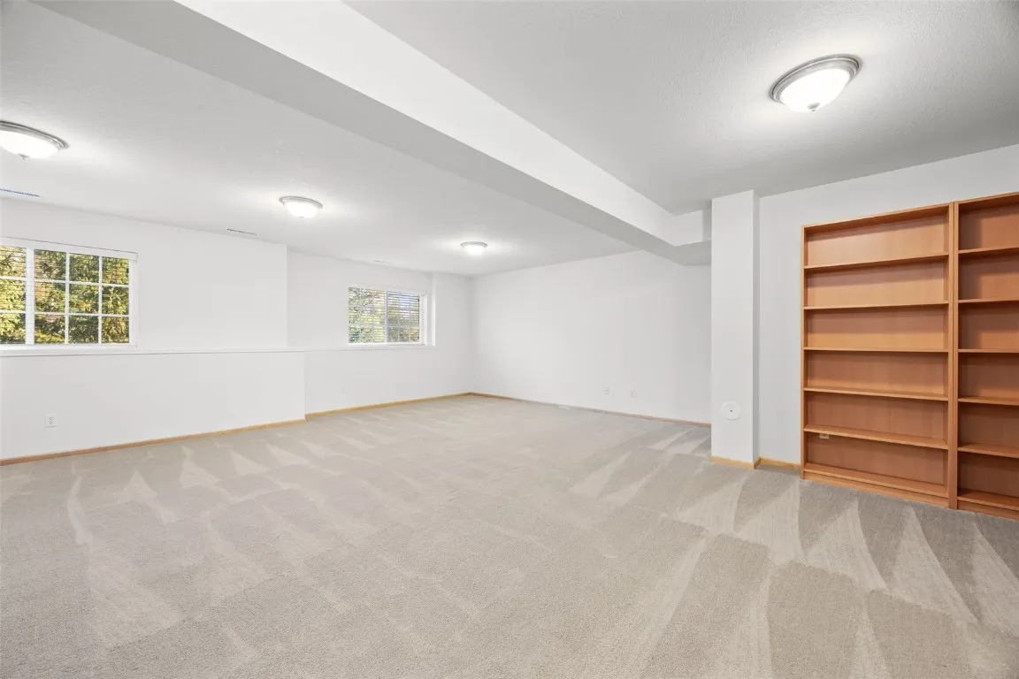 Handsome lower level.  Built-in bookshelves.