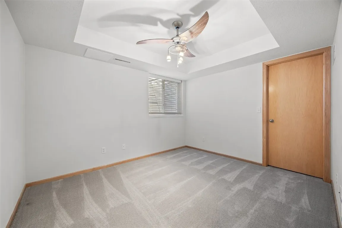 Lower Level Bedroom 3.  Check out the HUGE closet.  Egress window with mini-ladder.