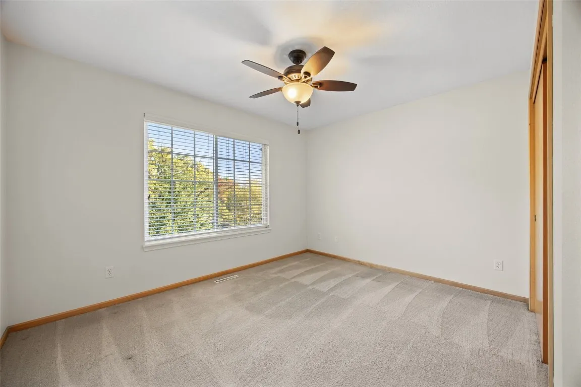 Bedroom 2, on main floor. Window treatment included.