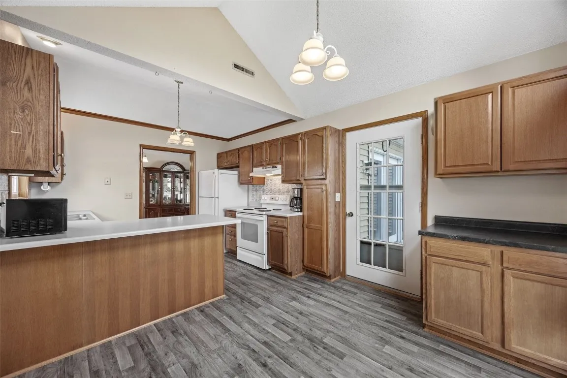 Eat in kitchen view towards deck entry.