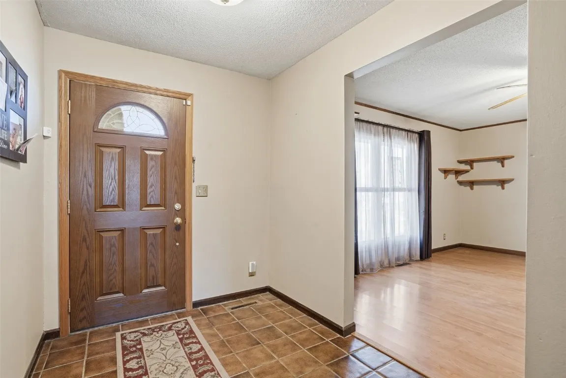 Entry way with great space. Look at the great lighting in the front room