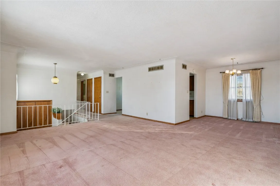 Livingroom when entering upper level and formal dining room.