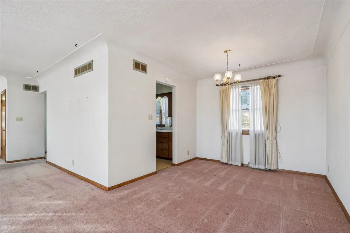 Livingroom when entering upper level and formal dining room.