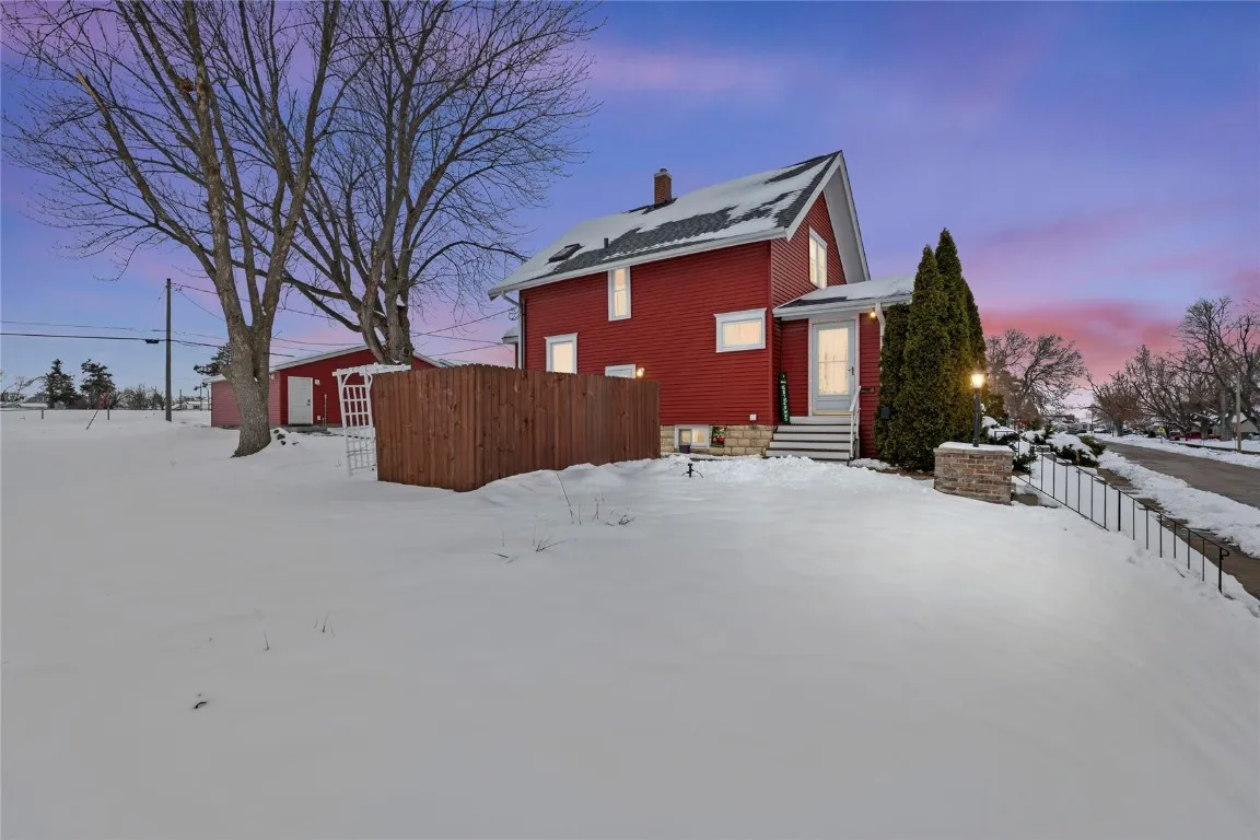 Side view of 2448 2nd St SW Cedar Rapids from street showing 0.39 acre lot, garage, and side enterance