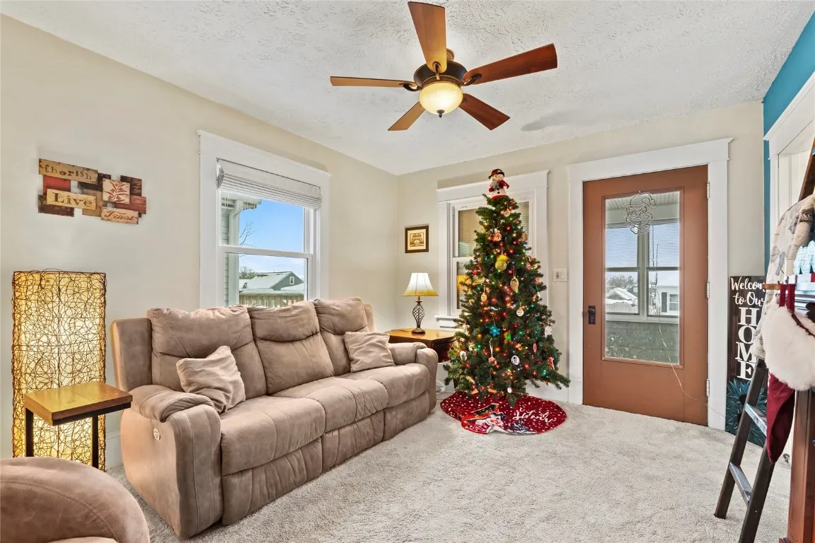 Living room facing front door leading to breezeway - 3 Seasons Room