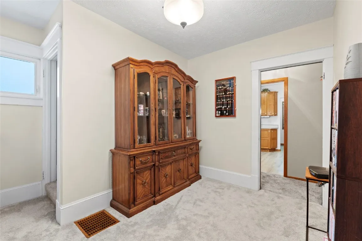 Bonus Room beside Living Room before steps leading to 2nd floor. See Kitchen through door