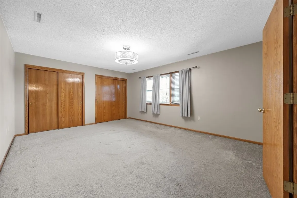 Primary bedroom features plenty of space with large double closets!