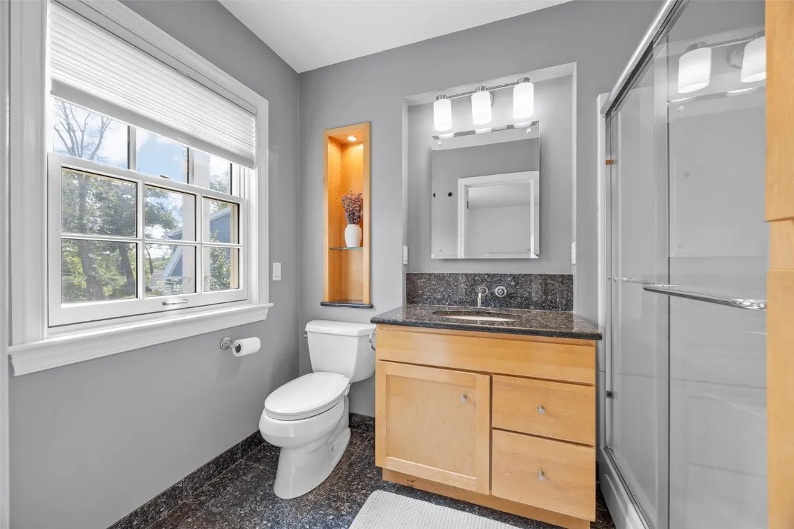 Full bath in the primary suite is fully updated