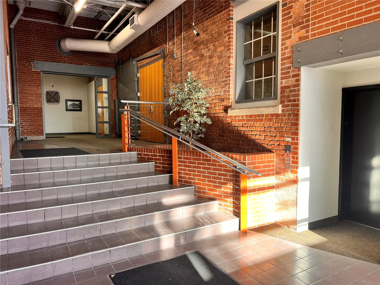 Building entrance with exterior suite entrance and elevator