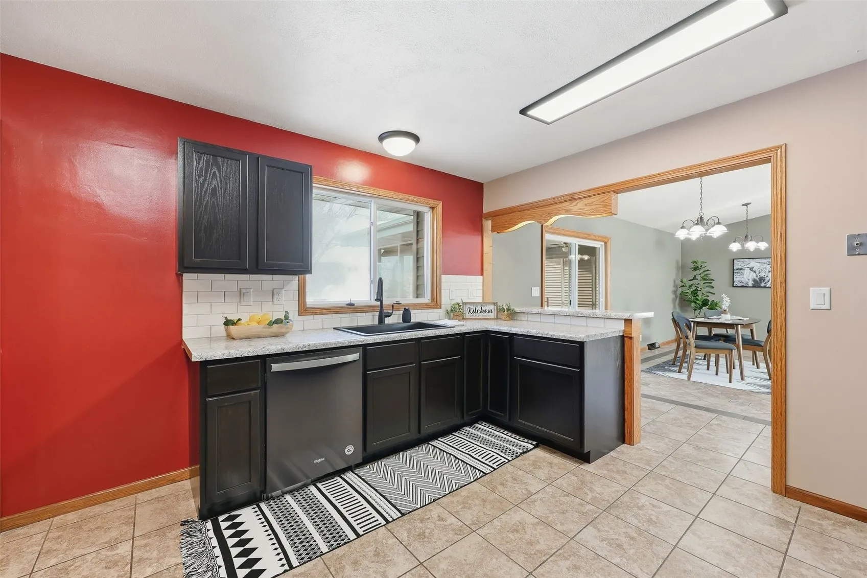 The window above the sink makes cleanup a little more enjoyable. You can also communicate with your 'grill master' while working in the kitchen.