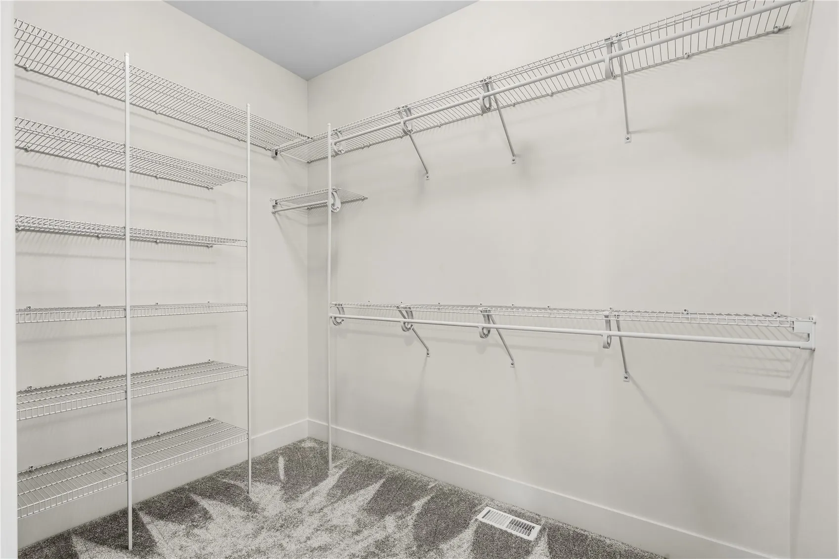 Primary bedroom walk-in closet.