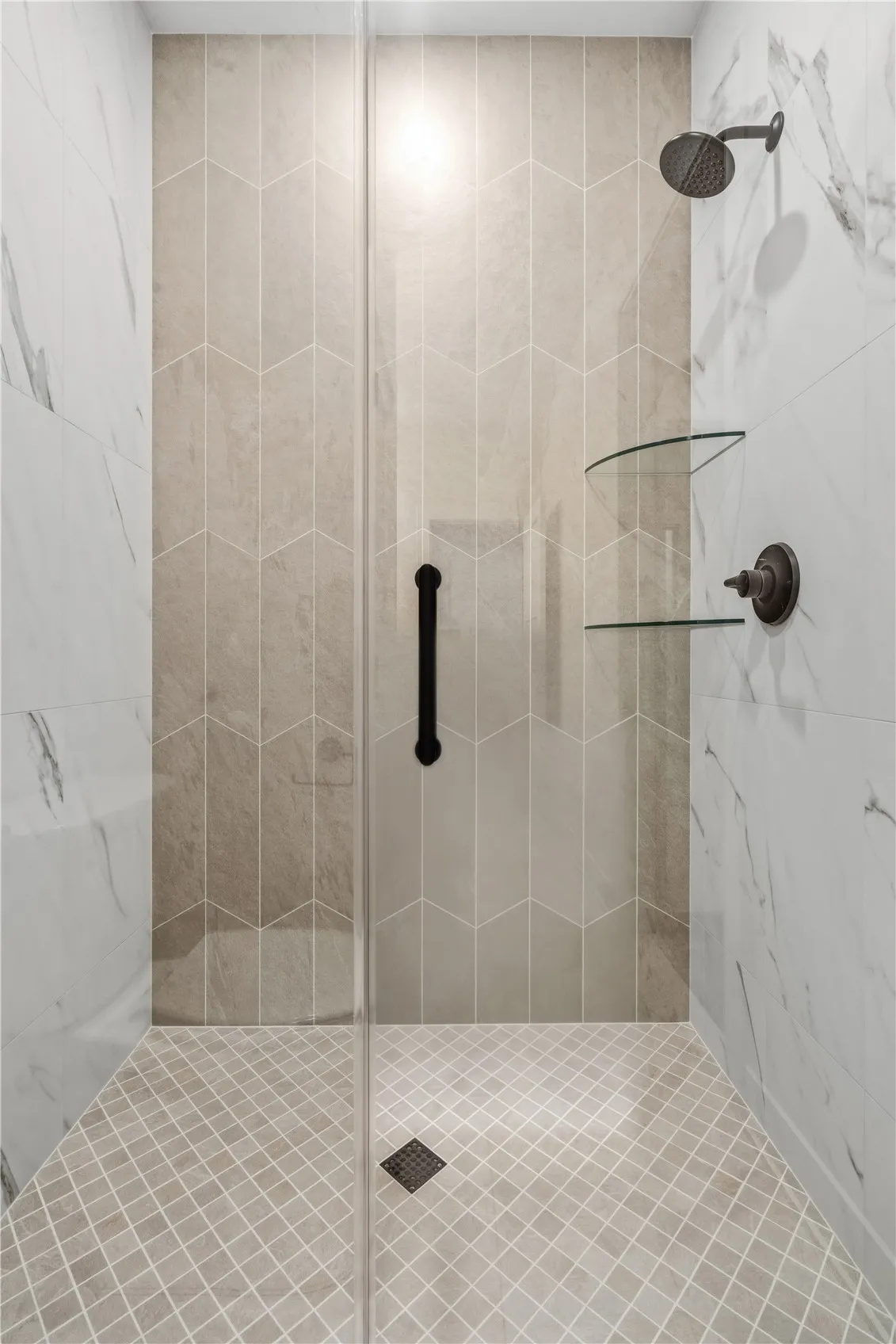 Fully tiled primary shower.