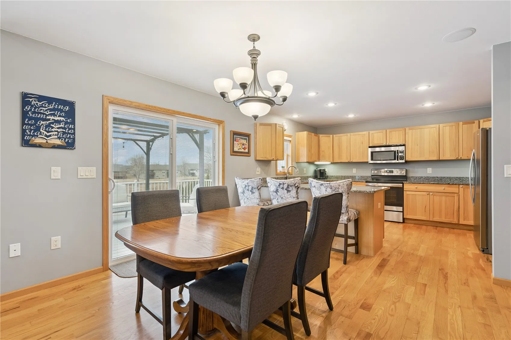 Dining room and kitchen area that leads to the deck