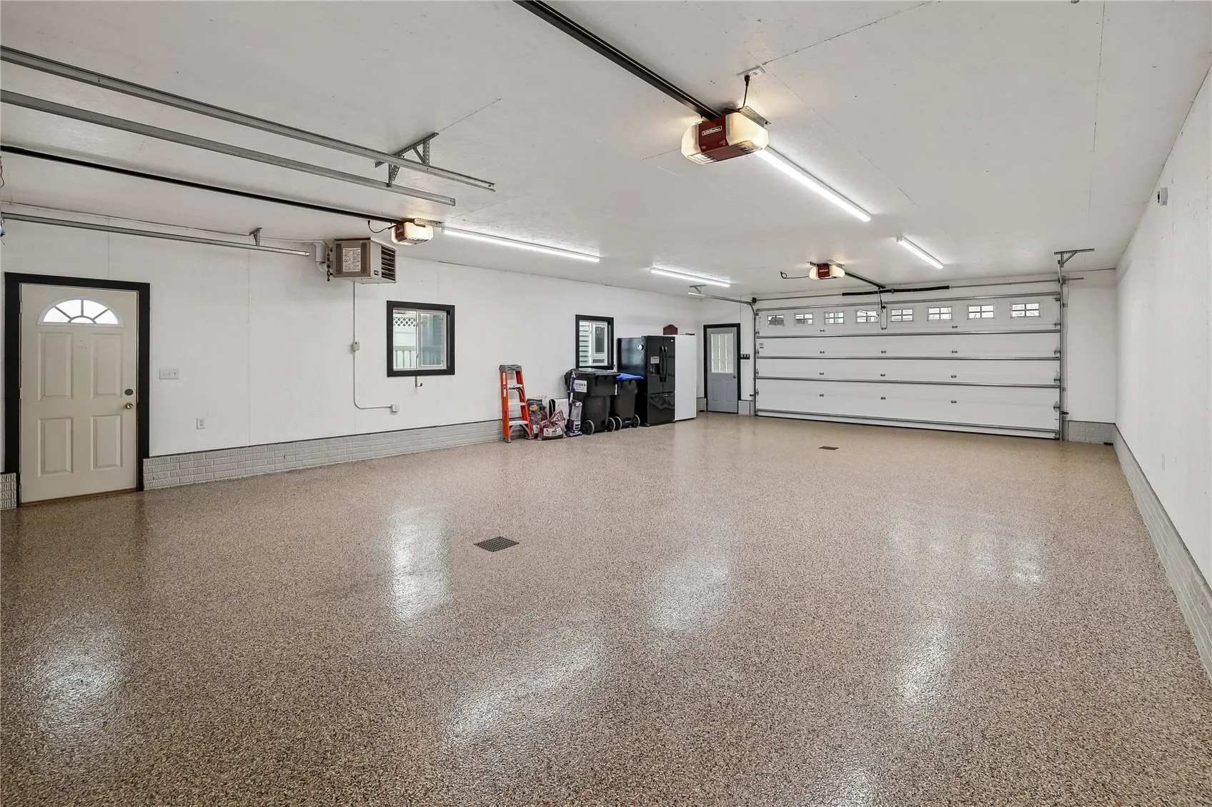 4 car garage w/ heat & floor drains