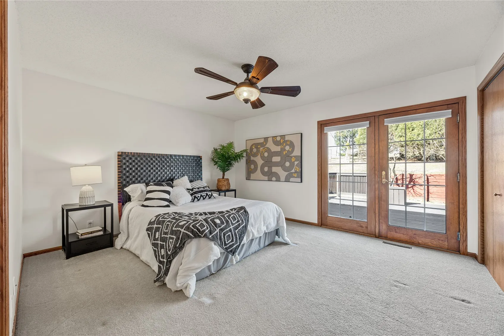 Primary Bedroom. Has 2 large closets. Walks out to deck.
