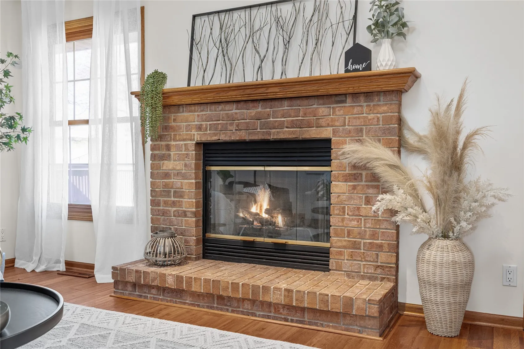 Gas fireplace. Can burn wood or add a log insert or enclose as a gas only fireplace.