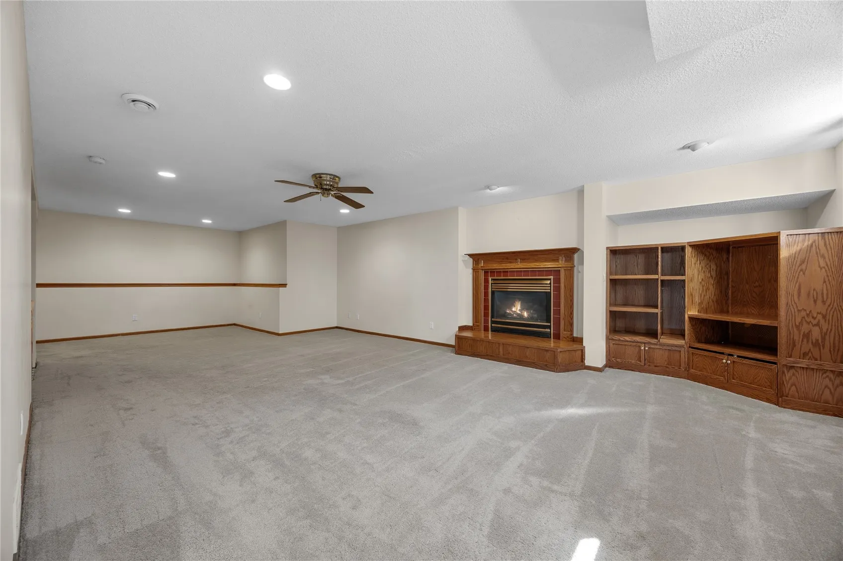 Basement living room w gas fireplace
