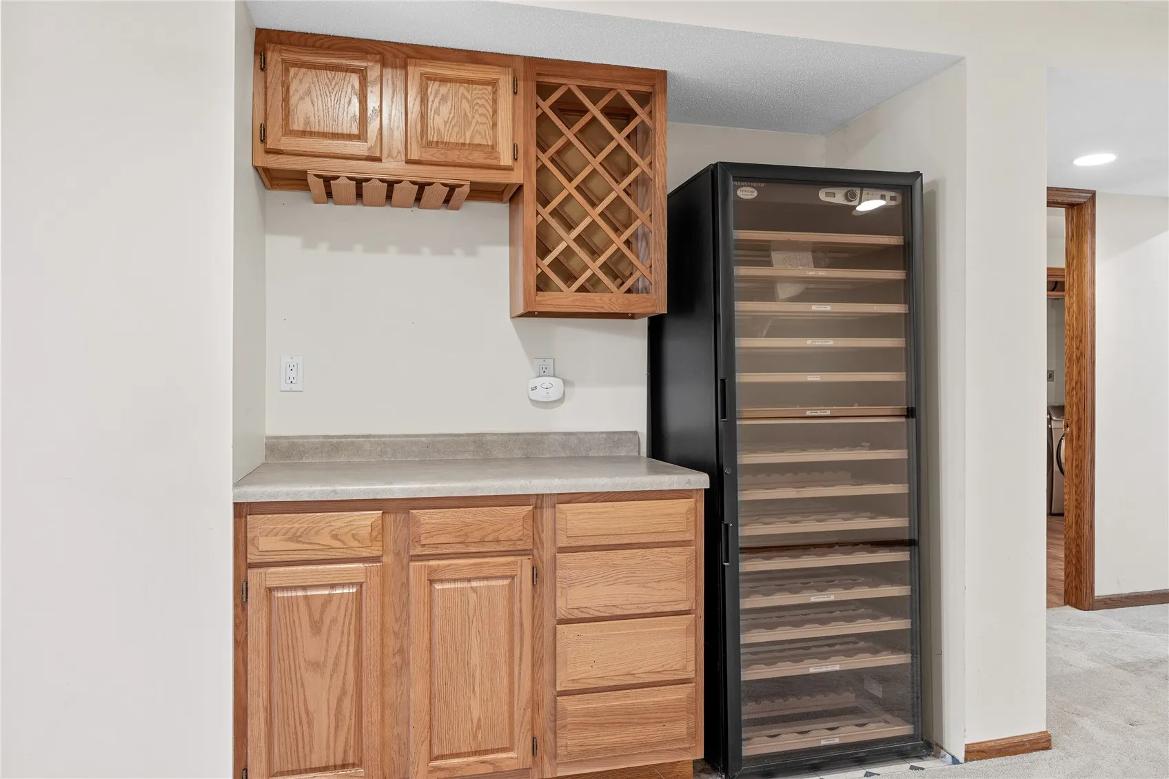 Built in bar and large wine refrigerator.