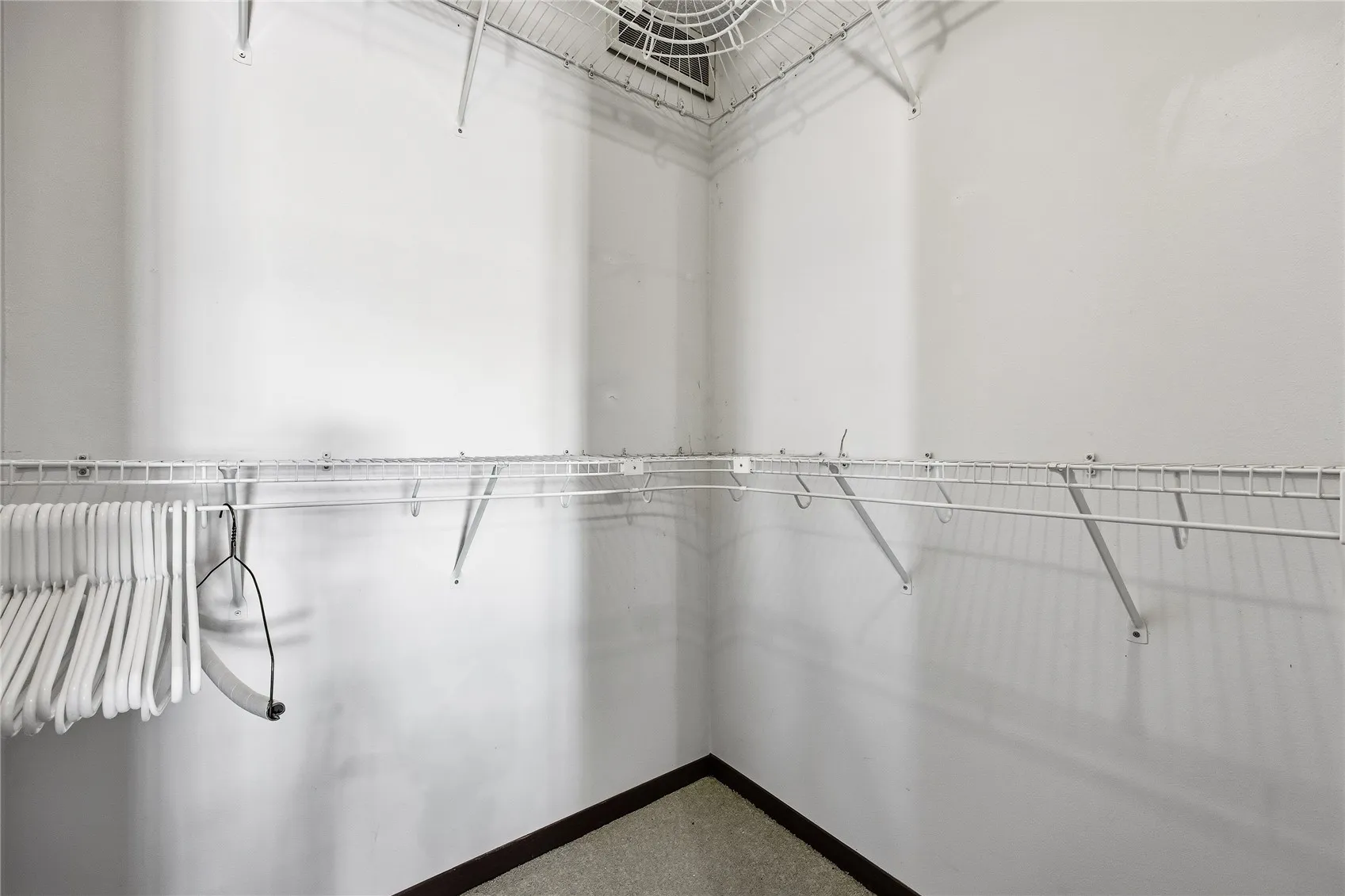 Walk-in closet off primary bedroom.