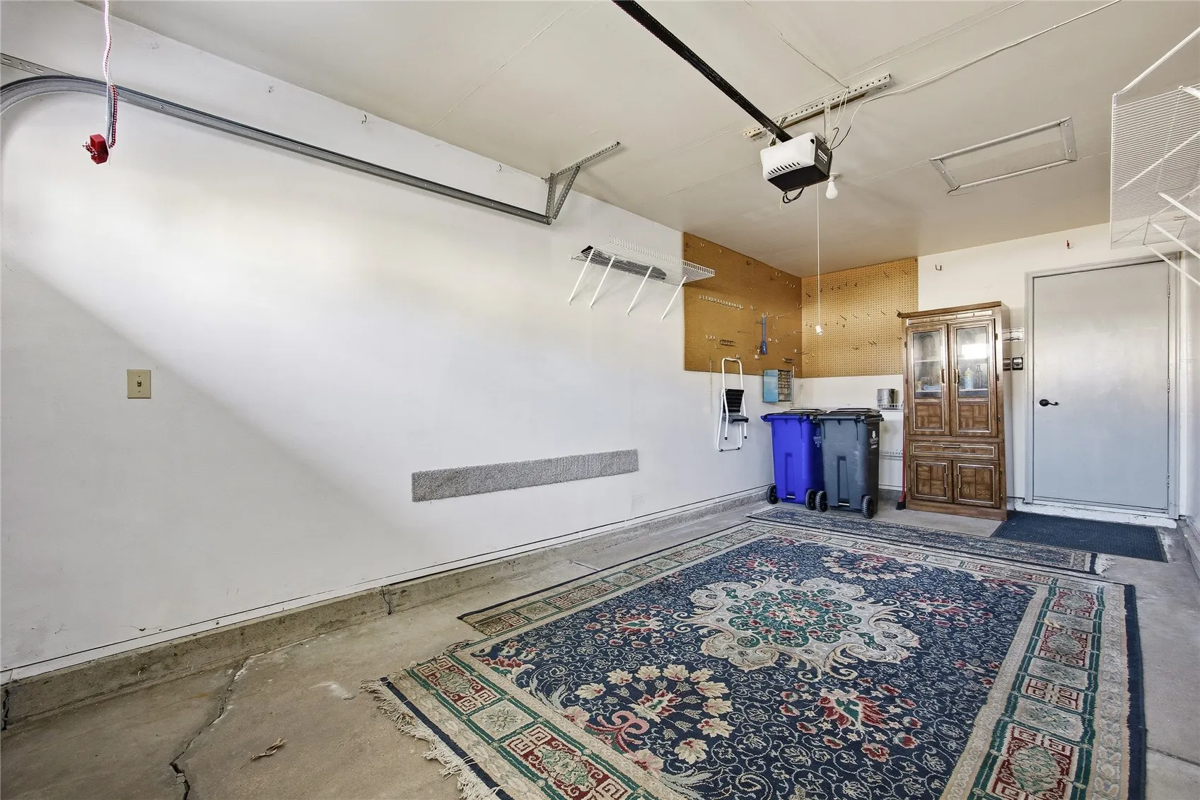 Neat and tidy interior of garage with nice shelving.