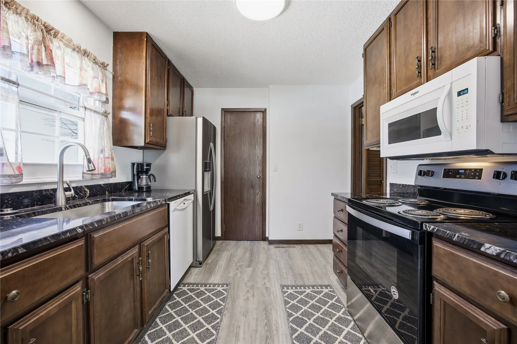 Kitchen with granite countertops.