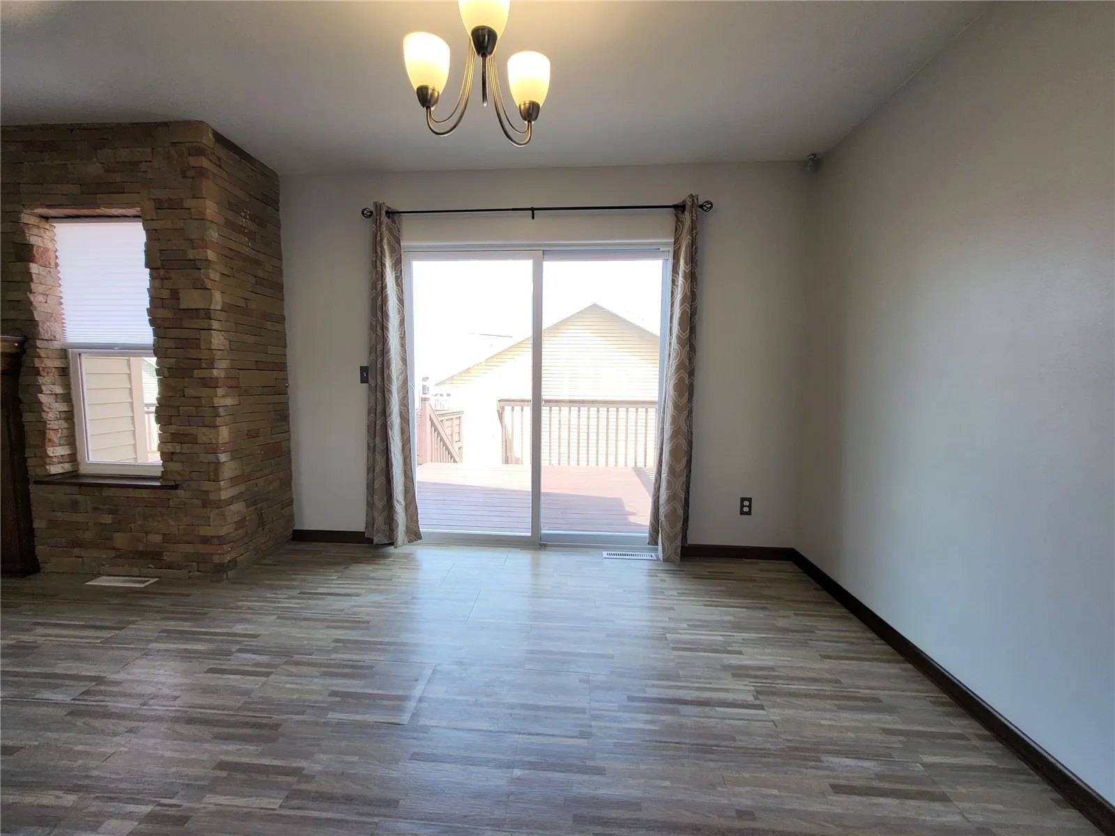 Dining area w/new sliding glass door.