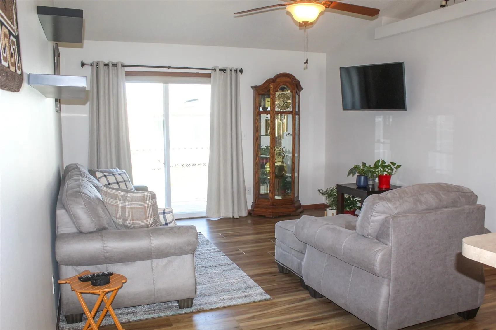 Living room view out to the deck. Newer flooring throughout.