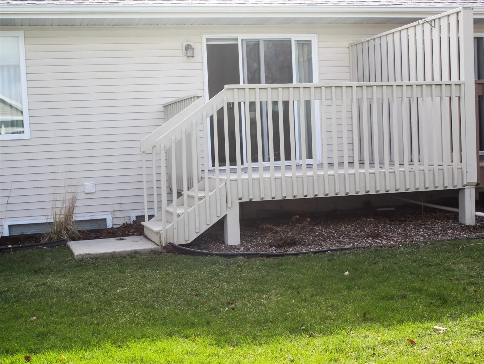 Back deck with steps off the patio door.
