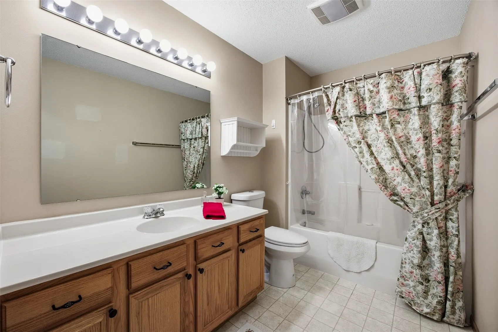 Guest bath is large and bright