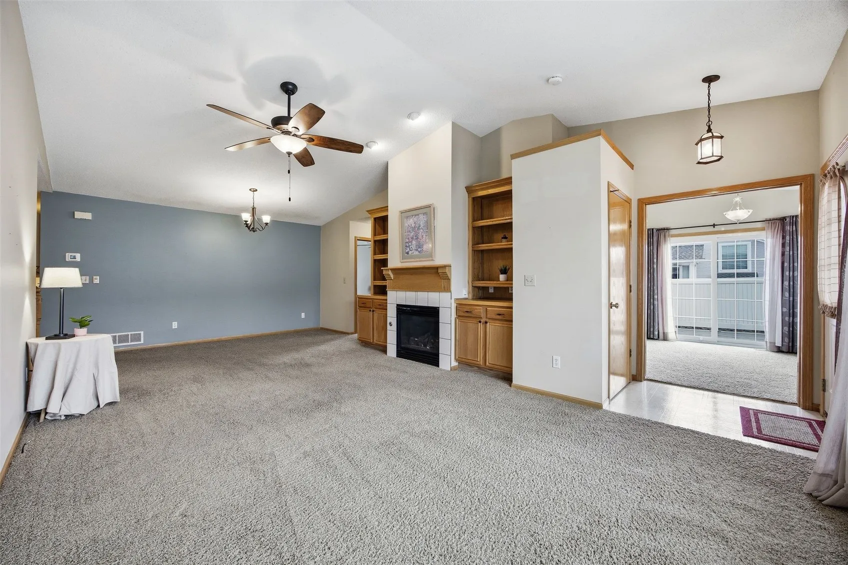 Very spacious great room with beautiful built in gas fireplace and bookcase surround