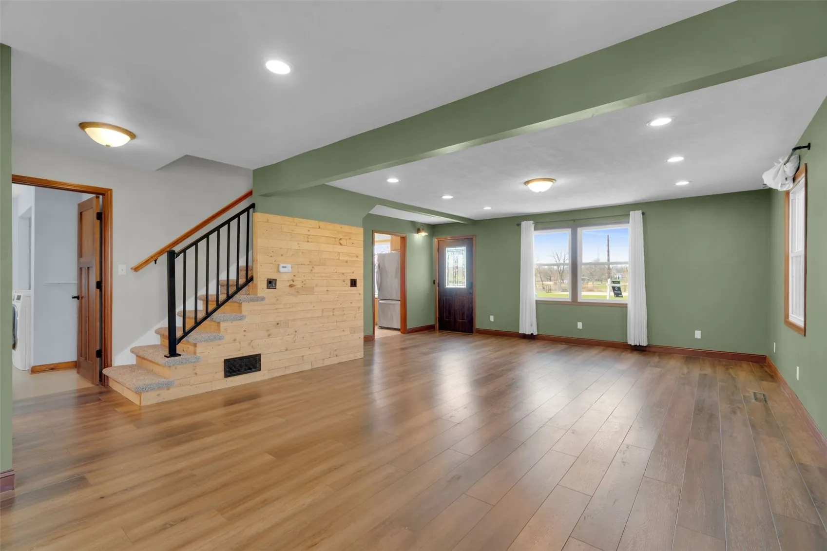 Large Living area with new paint and flooring in 2026